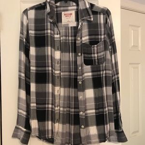 black, gray, and white flannel